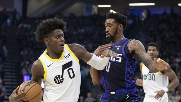 Utah Jazz forward Taylor Hendricks (0) dribbles the basketball against Sacramento Kings guard Malik Monk (0) during the first quarter at Golden 1 Center.